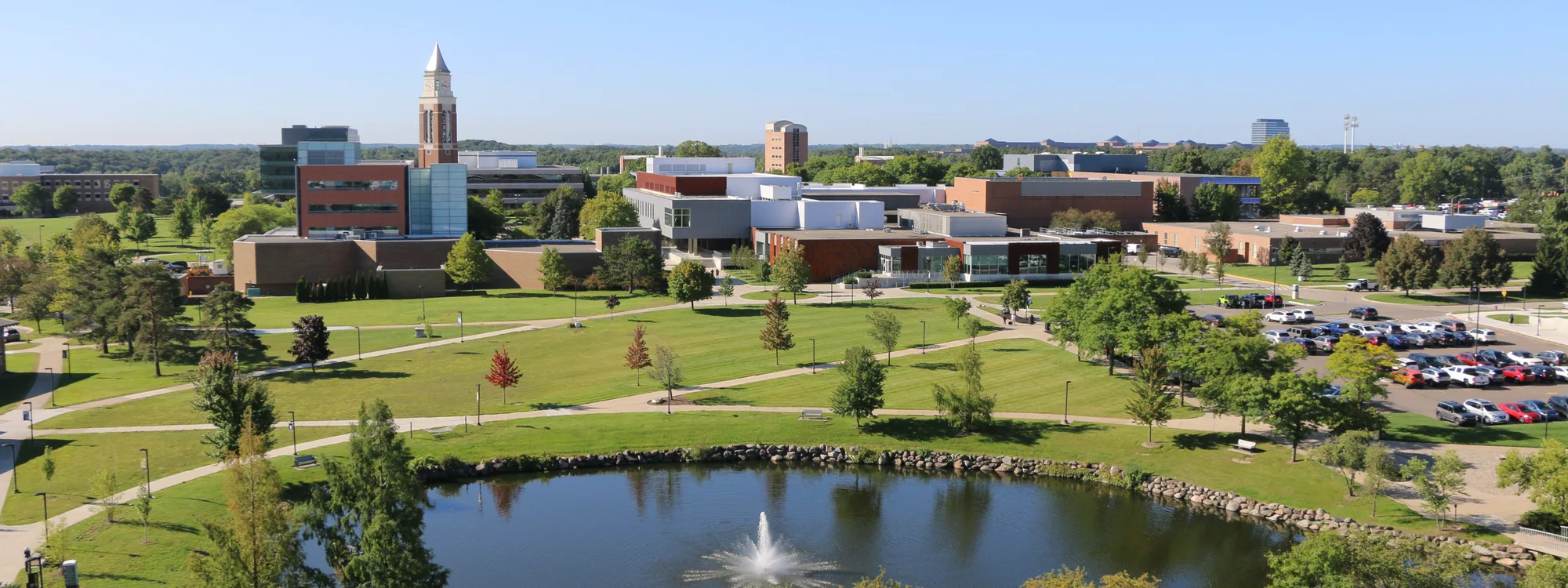 Aerial view of the Oakland University campus, Bear Lake, and Elliott Tower